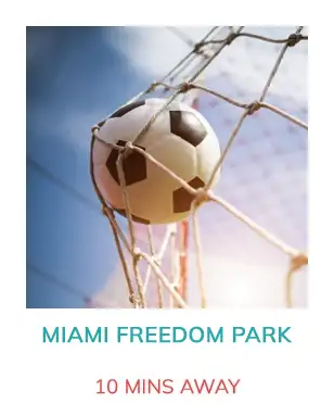 Soccer ball in net with sunny sky. Text below: Miami Freedom Park in blue, 10 mins away in red.